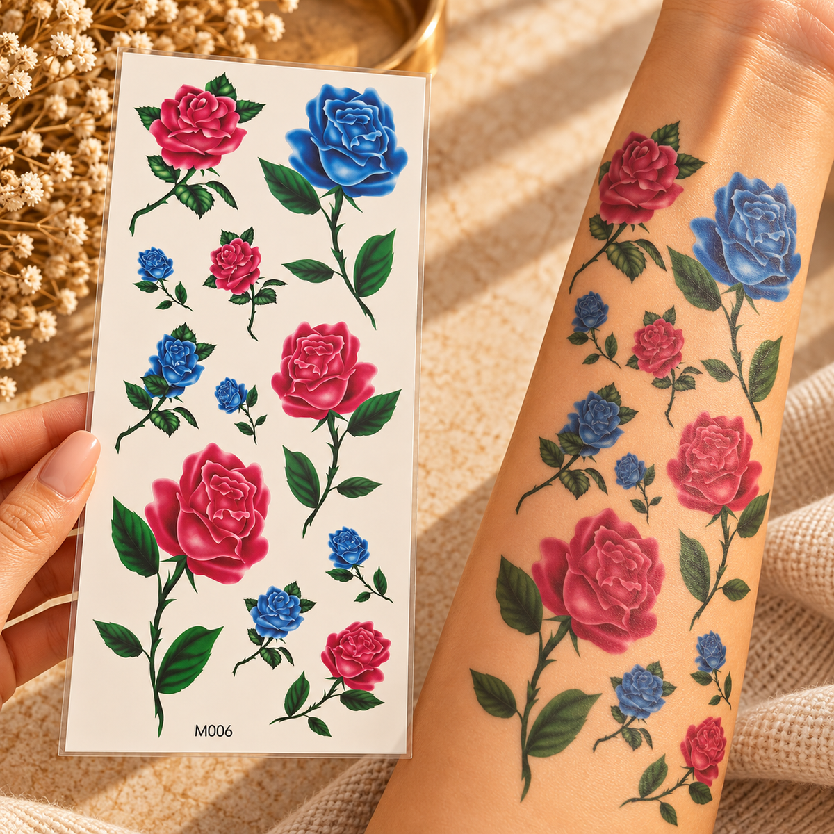 Pink and blue rose temporary tattoo sticker sheet with green leaves beside tattoos applied to an arm