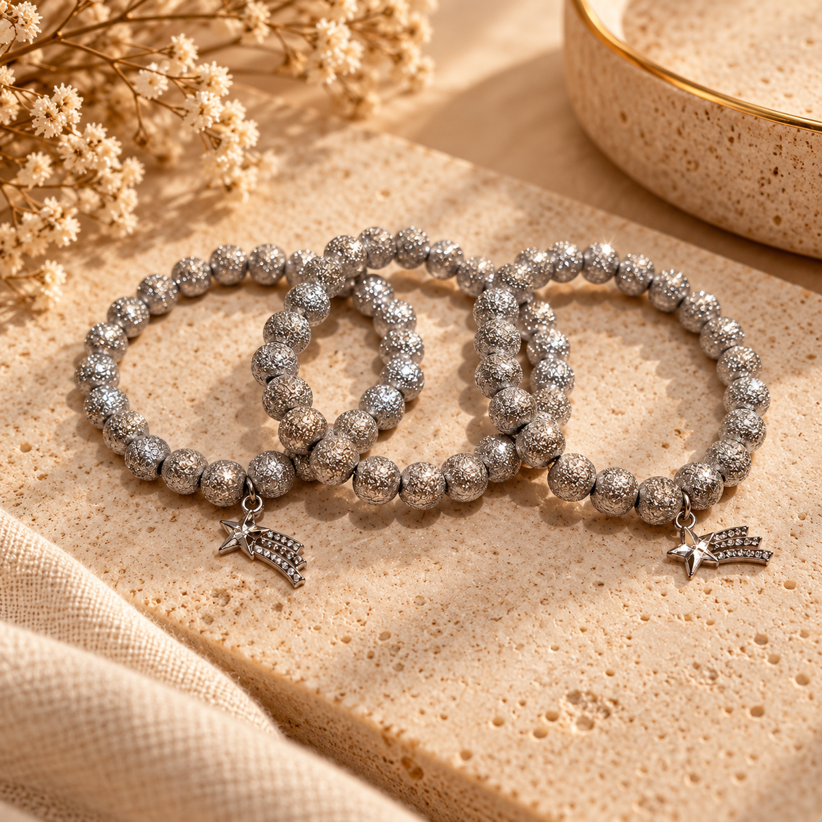 Silver-tone textured beaded bracelets with sparkling shooting-star charms