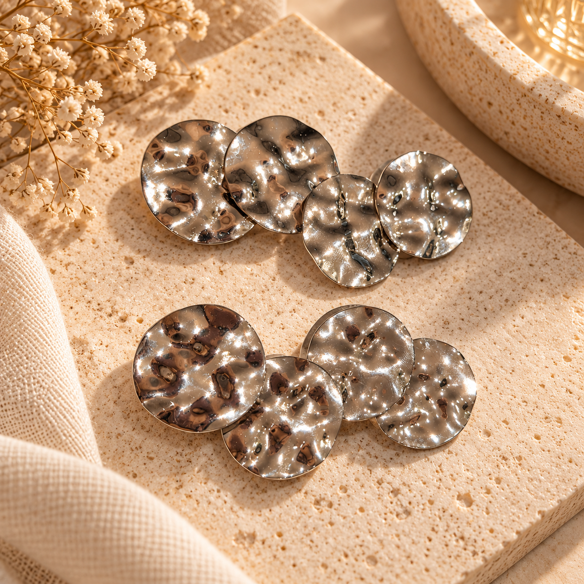 Silver-tone statement earrings with layered overlapping textured hammered discs