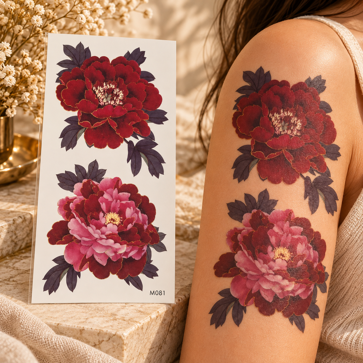 Large burgundy and pink peony temporary tattoo sheet shown applied to an upper arm