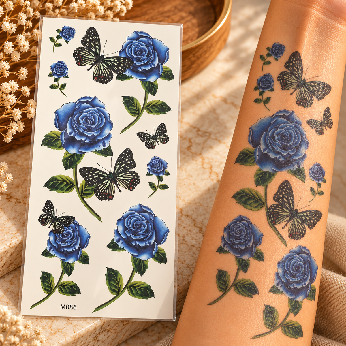 Blue rose and black butterfly temporary tattoo sticker sheet shown beside tattoos applied to an arm