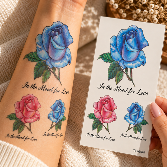 Blue and pink rose temporary tattoo designs with In the Mood for Love script, shown on an arm beside the tattoo sheet