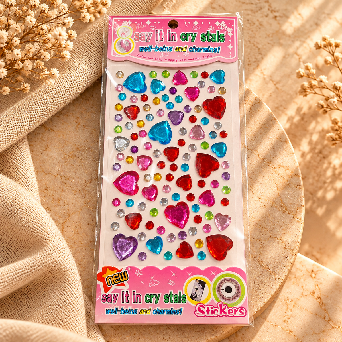 Sheet of colourful self-adhesive heart-shaped crystal gems and round rhinestone stickers