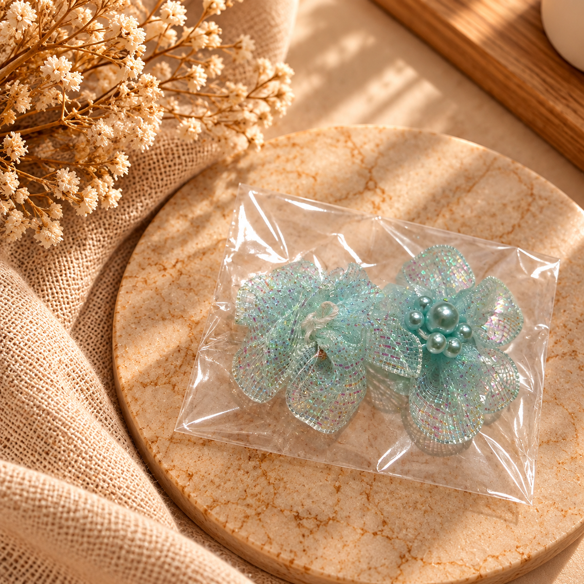 Mint-green shimmering mesh flower embellishments with pearl-style centres