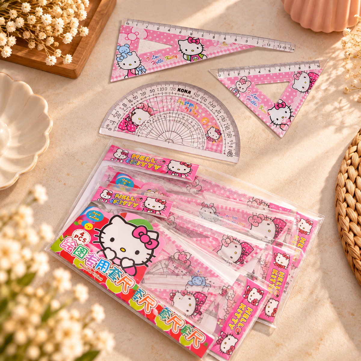 Pink character geometry set with ruler, two set squares and protractor