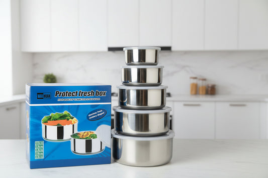 Set of stainless steel containers with packaging labeled 'WON HUAN' on a kitchen counter.