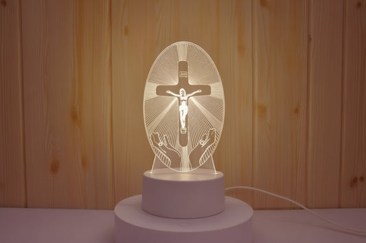 Decorative lamp with religious design on a wooden background