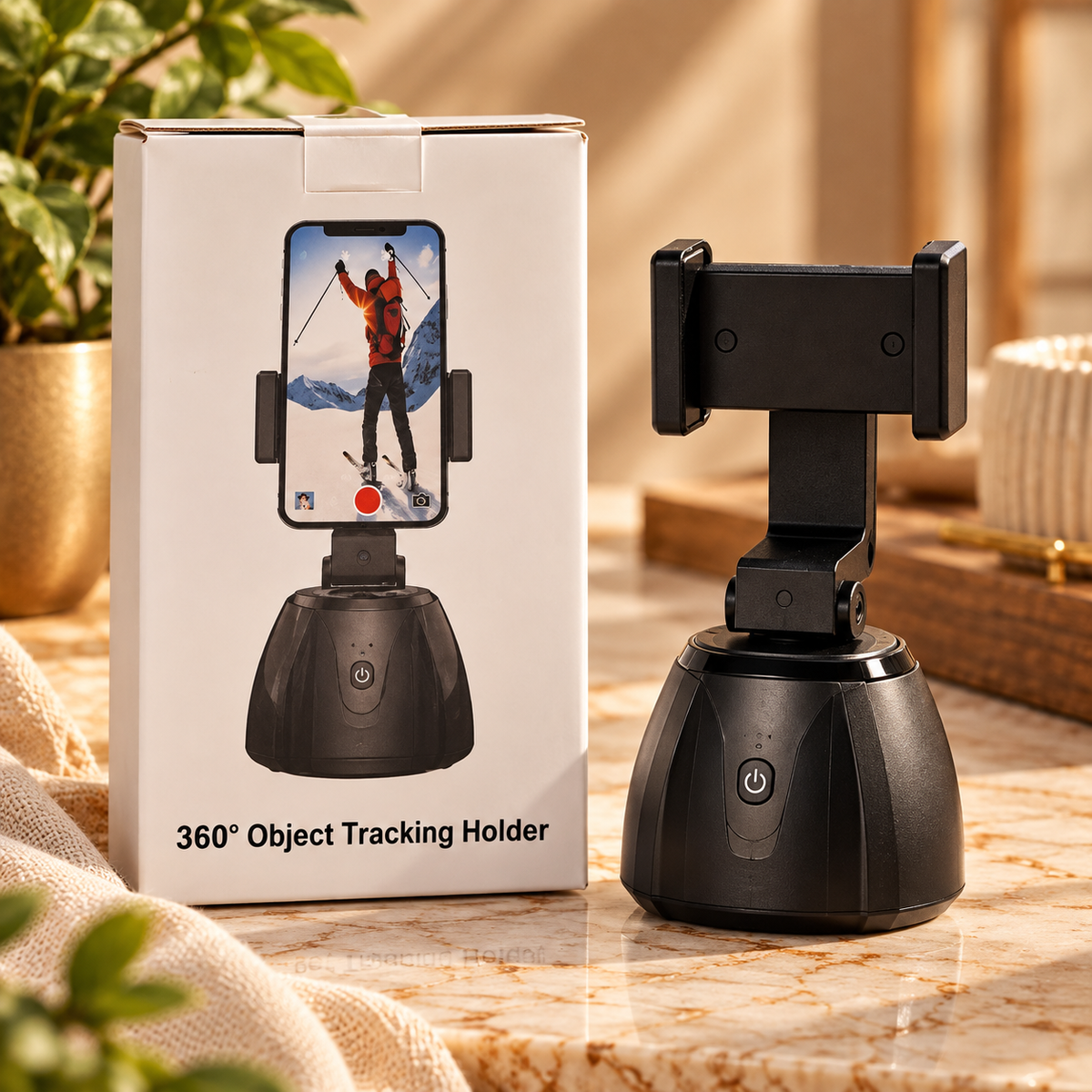 Black 360° object tracking phone holder beside its product box