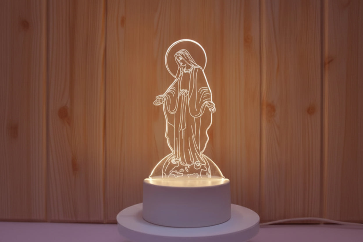 Decorative night light shaped like a religious figure on a wooden background